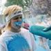 A runner is sprayed in the face during the Ypsilanti Color Run on Saturday, May 11. Daniel Brenner I AnnArbor.com